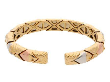 Brazalete hechura abierta con diamantes firma Bvlgari en oro dos tonos 18 kilates. Discount