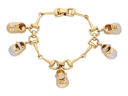 Pulsera hechura especial en oro amarillo 18 kilates con cinco dijes motivo zapato con diamantes en oro dos tonos 14 kilates Sale